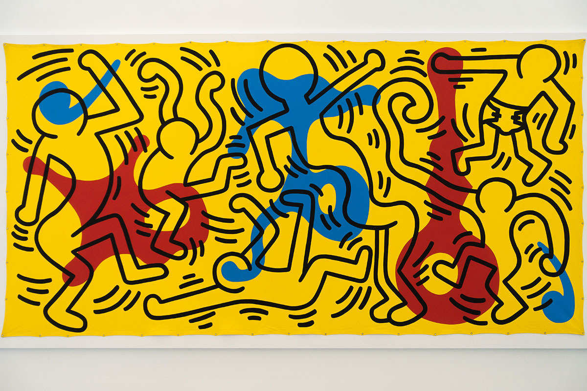 Keith Haring Pop-Art-Persiflage: Tanzende Menschen, einer davon mit Windel